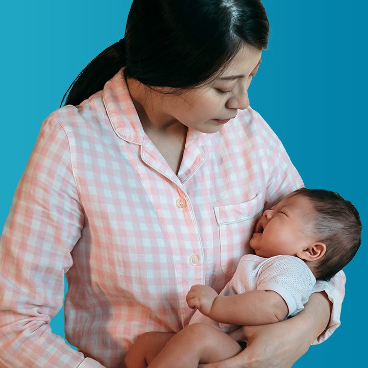 Mother holding crying baby
