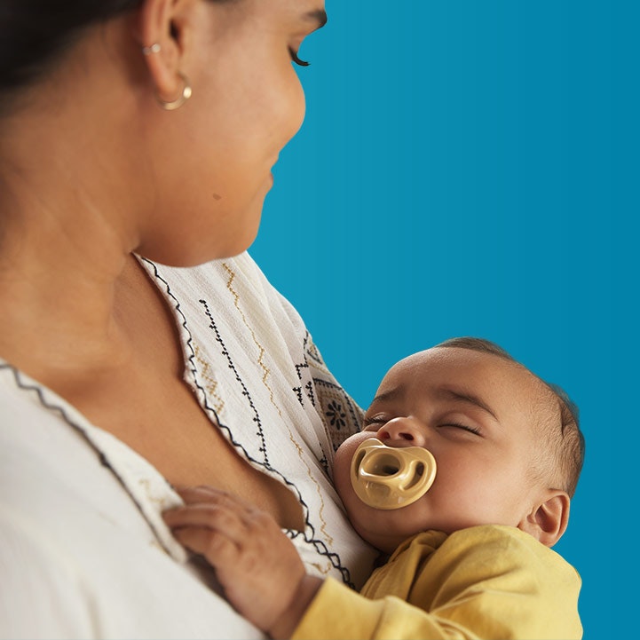 baby sleeping with pacifier